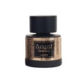 Lattafa Tamima — A black perfume bottle with a gold ornate pattern on the base and a black cap, featuring Arabic and English text on a black label. | Botol minyak wangi hitam dengan corak berhias emas di bahagian tapak dan penutup hitam, menampilkan teks Arab dan Inggeris pada label hitam.