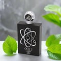 Lattafa Pride Tharwah Silver by Lattafa Pride 100ml EDP — Botol minyak wangi hitam dengan reka bentuk simbol atom perak dan penutup perak, dikelilingi daun hijau.