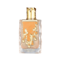Maison Alhambra Sugar Me Carrot Cake by Maison Alhambra 100ml EDP — Clear glass perfume bottle with a gold cap and orange dripping design on the front.