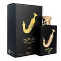 Lattafa Pride Ishq Al Shuyukh Gold — Black perfume box and bottle with gold dagger emblem and gold cap, isolated on white.