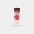 Maison Alhambra Camille by Maison Alhambra 100ml EDP — A clear glass perfume bottle with pink liquid, a burgundy rose-shaped cap, and gold accents. Features a circular pink rose design on the label.
