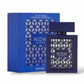 Rave Now Intense by Rave 100ml EDP — Botol minyak wangi biru gelap dengan corak geometri di hadapan, bersebelahan dengan kotak biru gelap sepadan yang mempunyai reka bentuk geometri serupa.