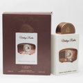 Lattafa Pride Vintage Radio — Brown box with a cutout showing a white box containing a vintage radio perfume bottle with a copper cap.