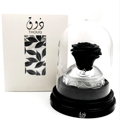Lattafa Pride Thouq by Lattafa Pride 80ml EDP — Black preserved rose under a glass dome on a black base, next to its white packaging with leaf pattern.