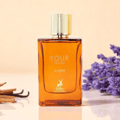 Maison Alhambra Your Touch Amber by Maison Alhambra 100ml — Amber glass perfume bottle with gold fluted cap, set against a soft peach background with lavender sprigs and cinnamon sticks.