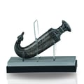 Niche Emarati Khanjar 85ml EDP — Ornate, curved dagger-shaped perfume bottle with intricate metalwork, displayed on a stand with clear acrylic supports against a white background.