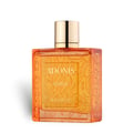 Rayhaan Adonis Icarus Rayhaan Perfume 100ml — A square, amber-colored glass perfume bottle with a gold cap, featuring intricate embossed patterns on its sides and a central label with text. | Rayhaan Adonis Icarus Rayhaan Perfume 100ml — Botol kaca berbentuk segi empat berwarna ambar dengan penutup emas, menampilkan