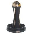 Lattafa Pride Al Khas Winners Trophy Gold 100ml — A black and gold trophy with a globe on top, set on a black base with Arabic and English text. | Lattafa Pride Al Khas Winners Trophy Gold 100ml — Piala hitam dan emas dengan globe di atasnya, diletakkan di atas tapak hitam dengan teks Arab dan Inggeris.