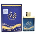 Ard Al Zaafaran Al Qannas Eau De Parfum 100ml — A blue perfume bottle and its matching blue box with gold wavy lines and Arabic calligraphy are displayed side-by-side against a white background. | Ard Al Zaafaran Al Qannas Eau De Parfum 100ml — Botol minyak wangi biru dan kotak birunya yang sepadan dengan garisan