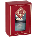 Al Wataniah Al Wataniah Rawaee Monarch Eau De Parfum 100ml — Red gift box with a window revealing a dark glass perfume bottle with gold accents and Arabic script. | Al Wataniah Al Wataniah Rawaee Monarch Eau De Parfum 100ml — Kotak hadiah merah dengan tingkap memaparkan botol minyak wangi kaca gelap dengan aksen emas