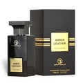 Grandeur Amber Leather 100ml by Grandeur Perfumes — A dark, rectangular perfume bottle with a gold label sits next to its matching black and gold striped box against a white background. | Grandeur Amber Leather 100ml oleh Grandeur Perfumes — Botol minyak wangi segiempat gelap dengan label emas duduk di sebelah kotak