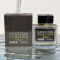 Paris Corner Autograph 100ml — A perfume box and bottle are displayed on a reflective surface with water effects, with a stream of water pouring from above. | Paris Corner Autograph 100ml — Kotak dan botol minyak wangi dipamerkan di permukaan reflektif dengan kesan air, dengan aliran air mengalir dari atas.