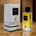 Maison Alhambra Winsome by Maison Alhambra 90ml EDP — A white box with wavy lines and a deer logo sits next to a clear glass perfume bottle filled with golden liquid, both featuring the 'Winsome Eau de Parfum' label.
