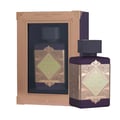 Lattafa Bade'e Al Oud Amethyst Fusion 100ml — A purple perfume bottle with a gold geometric label and dark cap, displayed next to its matching rose gold framed box containing another bottle.
