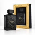 Lattafa Bade'e Al Oud Black Exposed — Black perfume bottle with ornate black and gold detailing, presented next to its gold-accented display box. The box shows another bottle inside.