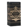 Ard Al Zaafaran Badee Al Oud Eau De Parfum 50ml — Black perfume box with intricate gold geometric patterns and Arabic text. | Ard Al Zaafaran Badee Al Oud Eau De Parfum 50ml — Kotak minyak wangi hitam dengan corak geometri emas yang rumit dan teks Arab.
