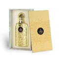 Lattafa Bayaan Eau De Parfum 100ml by Lattafa — A gold-embossed perfume bottle with Arabic calligraphy sits in a white box next to an open gold box with matching calligraphy. | Lattafa Bayaan Eau De Parfum 100ml by Lattafa — Botol minyak wangi berukir emas dengan kaligrafi Arab duduk dalam kotak putih di sebelah kotak