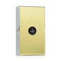 Lattafa Bayaan Eau De Parfum 100ml by Lattafa — A rectangular gold box with Arabic calligraphy design and a black circular logo with the brand name 'BAYAAAN' in gold. The sides of the box are white with a marble texture. | Lattafa Bayaan Eau De Parfum 100ml by Lattafa — Kotak emas berbentuk segi empat tepat dengan