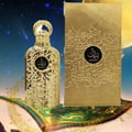 Lattafa Bayaan Eau De Parfum 100ml by Lattafa — Gold ornate bottle and matching box with Arabic calligraphy on a starry night background with a large moon and golden glitter accents | Lattafa Bayaan Eau De Parfum 100ml by Lattafa — Botol dan kotak emas berukir dengan kaligrafi Arab di latar belakang malam berbintang