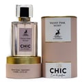 Maison Alhambra Chic Velvet Pink Secret for Women 100ml — A clear glass perfume bottle with a gold base and a pink cylindrical box, both featuring a deer logo and text. | Maison Alhambra Chic Velvet Pink Secret for Women 100ml — Botol minyak wangi kaca jernih dengan tapak emas dan kotak silinder merah jambu