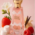 Khadlaj Cloud Candy Eau De Parfum — A pink perfume bottle with clouds design, gold cap, surrounded by strawberries, raspberries, marshmallows, vanilla pods, and a white flower. | Khadlaj Cloud Candy Eau De Parfum — Botol minyak wangi merah jambu dengan rekaan awan, penutup emas, dikelilingi strawberi, raspberi