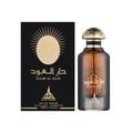 Paris Corner Daar Al Oud Intense 100ml — Black box with gold sunburst and Arabic text next to a glass perfume bottle with gold cap and matching design. | Paris Corner Daar Al Oud Intense 100ml — Kotak hitam dengan pancaran matahari emas dan teks Arab di sebelah botol minyak wangi kaca dengan penutup emas dan reka