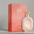 Zimaya Daiman Eden Eau De Parfum — A pink textured perfume bottle with a gold cap and a matching pink box with a marble-like pattern and gold text, displayed on a light grey surface. | Zimaya Daiman Eden Eau De Parfum — Botol minyak wangi bertekstur merah jambu dengan penutup emas dan kotak merah jambu yang sepadan