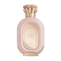 Zimaya Daiman Eden Eau De Parfum 100ml — A light pink oval perfume bottle with a textured surface and gold accents, featuring a gold embossed label with Arabic script and text. The cap is a pale pink, flower-like design with a gold base. | Zimaya Daiman Eden Eau De Parfum 100ml — Botol minyak wangi bujur berwarna