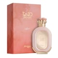 Zimaya Daiman Eden Eau De Parfum — A pink and gold box with marble-like texture stands next to a light pink glass perfume bottle with gold accents and a textured cap. | Zimaya Daiman Eden Eau De Parfum — Kotak merah jambu dan emas dengan tekstur seperti marmar berdiri di sebelah botol minyak wangi kaca merah jambu