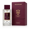 Bujairami Dead Serious — Clear glass perfume bottle with textured pattern and burgundy cap, next to a matching burgundy presentation box with gold logo.