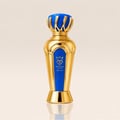 Bujairami Drip No. 7 Bujairami 100ml EDP — A tall, ornate gold perfume bottle with a vibrant blue accent panel and a decorative gold crown-like cap.