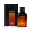 TADangel Dynasty pour homme — Kotak hitam bertekstur kayu dengan gradien oren dan logo emas di sebelah botol minyak wangi kaca ambar jernih dengan penutup hitam dan logo emas.