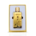 Maison Alhambra Minerale Gold by Maison Alhambra 100ml EDP — Gold-toned perfume bottle with textured cap, presented in a yellow gift box with a white insert.