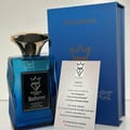Bujairami Enforcer Eau de Parfum — Blue glass bottle with gold cap, silver label, and a blue presentation box with gold crown logo. A product information card is also visible.