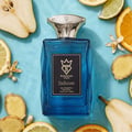 Bujairami Enforcer Eau de Parfum — Blue glass bottle with silver cap, surrounded by sliced citrus fruits, pear slices, and ginger.