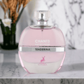 Maison Alhambra Chants Tenderina — Pink glass perfume bottle with a silver band and a deer logo, set on a marble surface with blurred floral background.