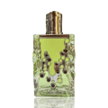Maison Alhambra Sugar Me Pistachio Chocolate — Clear glass perfume bottle with a lime green liquid and a textured silver cap, featuring a dripping design with brown and green circles.