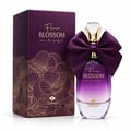 TADangel Fleur Blossom by TADAngel 100ml EDP Women — Purple box with gold floral pattern next to a gradient purple perfume bottle adorned with a large satin bow and crystal cap.