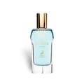 Maison Alhambra Glacier Flora 100ml — A clear glass perfume bottle with light blue liquid and a gold cap, featuring gold text and a deer logo. | Maison Alhambra Glacier Flora 100ml — Botol kaca jernih dengan cecair biru muda dan penutup emas, menampilkan teks emas dan logo rusa.