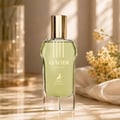 Maison Alhambra Glacier Heaven 100ml — A light green perfume bottle with a gold cap sits on a marble surface, with a blurred vase and flowers in the background. | Maison Alhambra Glacier Heaven 100ml — Botol minyak wangi hijau muda dengan penutup emas diletakkan di atas permukaan marmar, dengan pasu dan bunga yang