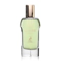Maison Alhambra Glacier Heaven 100ml — A clear glass perfume bottle with light green liquid, a gold cap, and embossed text and a deer logo on the front. | Maison Alhambra Glacier Heaven 100ml — Botol kaca jernih berisi cecair hijau muda, penutup emas, dan teks serta logo rusa tertera di hadapan.