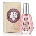Ard Al Zaafaran Hareem Al Sultan EDP 50ml — A pink glass perfume bottle with a silver cap stands next to its beige patterned box with a maroon ornate circular label. | Ard Al Zaafaran Hareem Al Sultan EDP 50ml — Sebotol minyak wangi kaca berwarna merah jambu dengan penutup perak berdiri di sebelah kotak bercorak