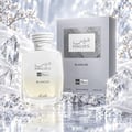 RASASI Hawas Blanche by Rasasi 100ml EDP — Clear glass perfume bottle with white rope-like cap, silver box with textured square, surrounded by clear faceted crystals and white fabric.