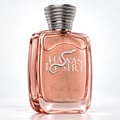 Botol minyak wangi Kenz de Rasasi Hawas Desire First Kiss — Botol kaca warna emas ros dengan lambang ular perak dan penutup bertekstur perak, berlatar belakang putih.
