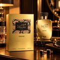 RASASI Hawas Exotic by Rasasi 100ml EDP — Gold textured box with snake print detail, gold bottle with black textured cap, glass of amber liquid, cufflinks, and watch on a wooden surface.