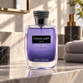 Kenz de Rasasi Hawas For Him Le Parfum — Purple glass bottle with black label, silver snake-like cap, on a marble surface with stacked towels and a marble dispenser in the background.