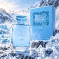 RASASI Hawas Ice Freeze by Rasasi 100ml EDP — Botol kaca jernih berisi cecair biru dan penutup biru bertekstur, bersebelahan kotak biru, di latar belakang landskap gunung salji dan ais.