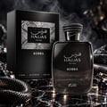 RASASI Hawas Kobra by Rasasi 100ml EDP — Black perfume bottle and box with snake-themed cap and accents, set against a dark, textured background with shimmering elements and smoke.