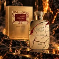 RASASI Hawas Lava Gold by Rasasi 100ml EDP — Gold perfume bottle with cracked red lava design and gold box, set against a fiery, rocky background with smoke.