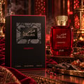 RASASI Hawas Majestic by Rasasi 100ml EDP — Red glass perfume bottle with gold textured cap, placed on a marble surface with its black box packaging in the background.